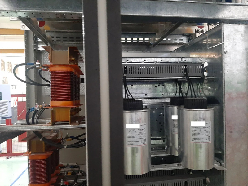 What is a compensating capacitor 11