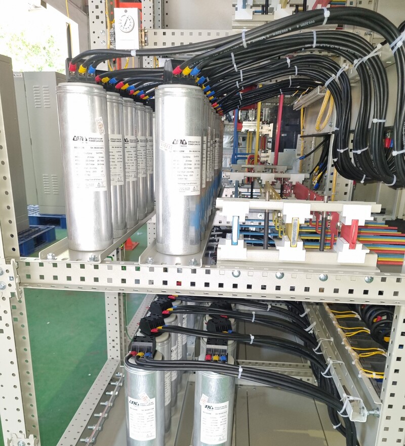 What is a compensating capacitor 12